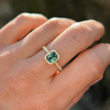 1.27ct Radiant Cut Madagascar Teal Sapphire Low Profile Bezel Solitaire Ring with French Set Diamonds in 14k Yellow Gold