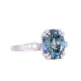 3.94ct Oval Unheated Deep Teal Blue Australian Sapphire Double Claw Prong Low Profile Milgrain and Diamond Ring in Platinum