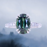 4.26ct Oval Deep Teal Madagascar Sapphire Double Claw Prong Low Profile Milgrain and Diamond Ring in Platinum