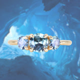 0.75ct Round Unheated Teal Blue Color Shifting Montana Sapphire and Montana Sapphire Side Three Stone Ring in 14k Yellow Gold