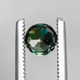 1.13CT BRILLIANT ROUND MADAGASCAR SAPPHIRE, COLOR SHIFTING WARM GREY TO BRIGHT GREEN TEAL, 5.72X74.42MM