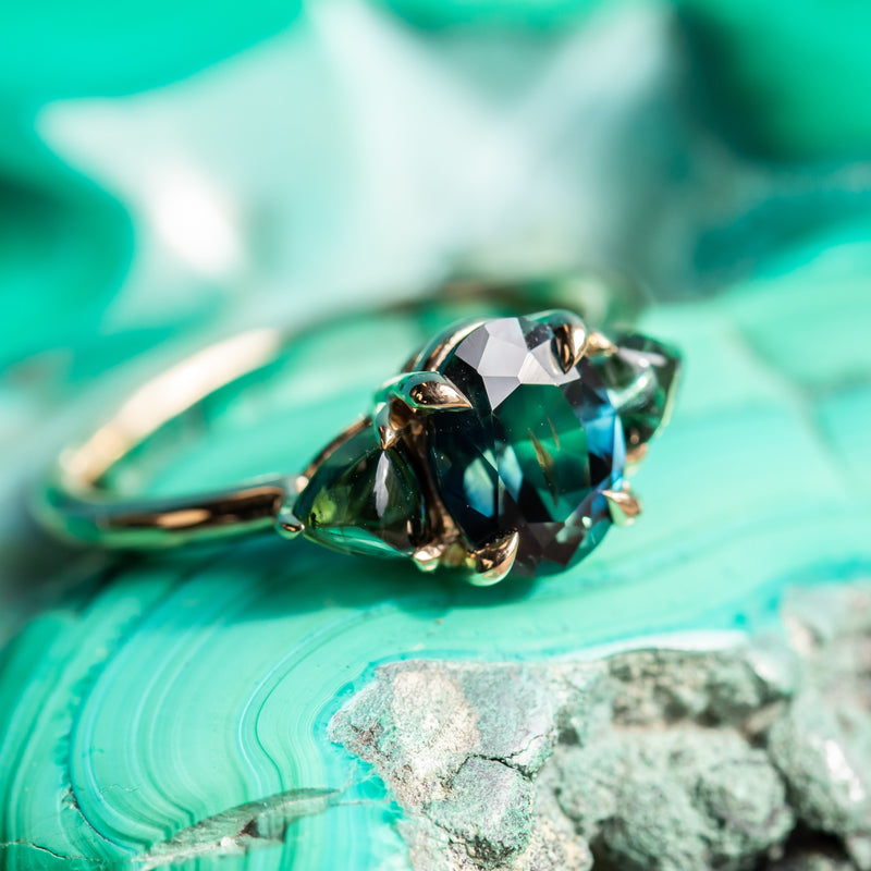 1.63ct Oval African Teal Blue Sapphire and Tourmaline Cabochon Trillion Three Stone Ring in 14K Yellow Gold