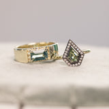 0.70ct Shield Cut Montana Sapphire and Blackened Gold Bezel Set Diamond Halo In 14k Green Gold