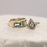 0.70ct Shield Cut Montana Sapphire and Blackened Gold Bezel Set Diamond Halo In 14k Green Gold