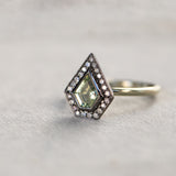 0.70ct Shield Cut Montana Sapphire and Blackened Gold Bezel Set Diamond Halo In 14k Green Gold