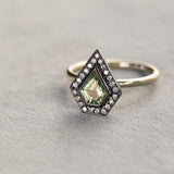 0.70ct Shield Cut Montana Sapphire and Blackened Gold Bezel Set Diamond Halo In 14k Green Gold
