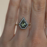 0.70ct Shield Cut Montana Sapphire and Blackened Gold Bezel Set Diamond Halo In 14k Green Gold