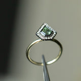 0.70ct Shield Cut Montana Sapphire and Blackened Gold Bezel Set Diamond Halo In 14k Green Gold