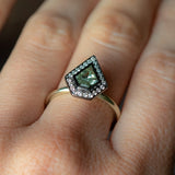 0.70ct Shield Cut Montana Sapphire and Blackened Gold Bezel Set Diamond Halo In 14k Green Gold