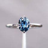 Blue Oval Moissanite Four Prong Compass Set Solitaire in 14k White Gold