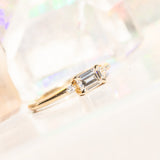 East-West Emerald cut Moissanite Asymmetrical Ring in 14k Yellow Gold