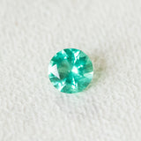 0.98CT ROUND BRILLIANT ZAMBIAN EMERALD, NEON GREEN TEAL, 6.91X4.2MM