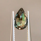 1.67CT PEAR TANZANIAN SAPPHIRE, COLOR SHIFTING FROM MERLOT PURPLE TO TEAL, 9.23X5.97X4.18MM