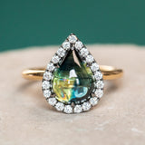 3.83ct Pear Cabochon Australian Sapphire and Blackened Halo ring in 18k Yellow Gold