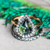 3.83ct Pear Cabochon Australian Sapphire and Blackened Halo ring in 18k Yellow Gold