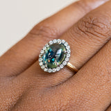 4.48ct Oval Cabochon Parti Sapphire and Blackened Halo ring in 18k Yellow Gold