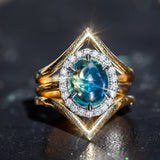 4.48ct Oval Cabochon Parti Sapphire and Blackened Halo ring in 18k Yellow Gold