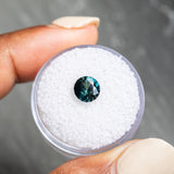 1.63CT ROUND NIGERIAN SAPPHIRE, PEACOCK GREEN, 7.01x4.50MM, UNTREATED