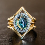 4.48ct Oval Cabochon Parti Sapphire and Blackened Halo ring in 18k Yellow Gold