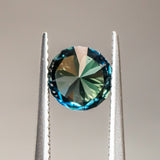 1.63CT ROUND NIGERIAN SAPPHIRE, PEACOCK GREEN, 7.01x4.50MM, UNTREATED