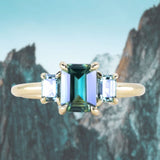 1.30ct Emerald Cut Madagascar Sapphire and 0.98ctw Montana Sapphire Three Stone Low Profile Ring in 18k Yellow Gold