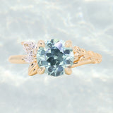 2.38ct Untreated Sky Blue Montana Sapphire in Wandering Vine Low Profile Four Prong Setting with Natural Diamonds in 14k Yellow Gold- Appraised Stone