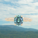 1.75ct Precision Cut Teal Oval Montana Sapphire Four Prong Evergreen Hidden Halo Solitaire in 14k Yellow Gold