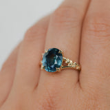 4.42ct Oval Blue Madagascar Sapphire in Wandering Vine Low Profile 4 Prong Setting with Diamonds in 14k Yellow Gold
