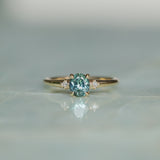 0.90ct Oval Light Blue Green Montana Sapphire and Princess Cut Diamond Rapids Low Profile Ring in 14k Yellow Gold