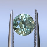 0.85CT ROUND PRECISION CUT MONTANA SAPPHIRE, LIGHT GREEN YELLOW, 5.55X3.70MM