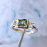 1.06ct Unheated Step Cut Teal Bezel Set Sapphire and White Cadillac Prong Set Sapphire Low Profile Three Stone Ring in 14k Yellow Gold