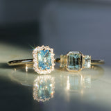 1.29ct Bezel Set Emerald Cut Untreated Montana Sapphire and Montana Sapphire Sides Three Stone Ring in 14k Yellow Gold