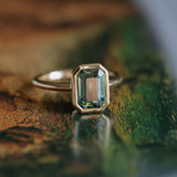 2.62ct Teal Green Emerald Cut Sapphire Low Profile Bezel Ring in 14k Yellow Gold