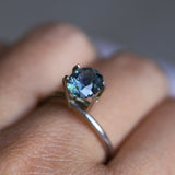 1.73CT PRECISION CUT OVAL MONTANA SAPPHIRE, DENIM PARTI TEAL WITH EARTHY INCLUSIONS, 7.47X6.16X4.69MM