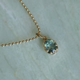 1.56ct Untreated Teal Green Nigerian Oval Sapphire 10 Prong Pendant in 14k Yellow Gold