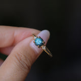 1.10ct Round Deep Teal Montana Sapphire and Princess Cut Diamond Rapids Low Profile Ring in 14k Yellow Gold