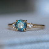1.10ct Round Deep Teal Montana Sapphire and Princess Cut Diamond Rapids Low Profile Ring in 14k Yellow Gold