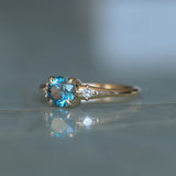1.10ct Round Deep Teal Montana Sapphire and Princess Cut Diamond Rapids Low Profile Ring in 14k Yellow Gold