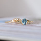 1.21ct Oval Blue Precision Cut Montana Sapphire Low Profile 4 Prong Leaf Bud Solitaire in 14k Yellow Gold