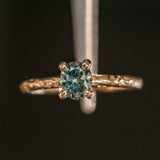 0.85ct Oval Precision Cut Ocean Blue Montana Sapphire Evergreen Carved 4 Prong Solitaire in 14k Yellow Gold