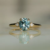 1.77ct Oval Precision Cut Parti Light Teal Montana Sapphire and Princess Cut Diamond Rapids Low Profile Ring in 14k Yellow Gold