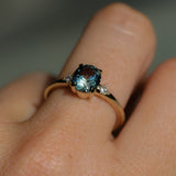 1.77ct Oval Precision Cut Parti Light Teal Montana Sapphire and Princess Cut Diamond Rapids Low Profile Ring in 14k Yellow Gold
