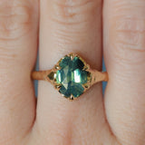 3.29ct Untreated Oval Parti Green Sapphire Low Profile 6 Prong Evergreen Carved Solitaire in 14k Yellow Gold