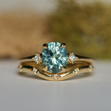 1.77ct Oval Precision Cut Parti Light Teal Montana Sapphire and Princess Cut Diamond Rapids Low Profile Ring in 14k Yellow Gold