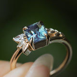 1.65ct Teal Blue Radiant Cut Madagascar Sapphire in Wandering Vine Low Profile 4 Prong Setting with Diamonds in 14k Yellow
