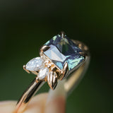 1.65ct Teal Blue Radiant Cut Madagascar Sapphire in Wandering Vine Low Profile 4 Prong Setting with Diamonds in 14k Yellow