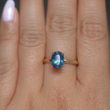 1.92ct Silky Teal Oval Nigerian Sapphire Evergreen Carved Solitaire in 14k Yellow Gold