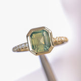 2.18ct Emerald Cut Parti Madagascar Sapphire Low Profile Bezel Solitaire Ring with Pavé Set Diamonds in 14k Green Gold
