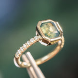 2.18ct Emerald Cut Parti Madagascar Sapphire Low Profile Bezel Solitaire Ring with Pavé Set Diamonds in 14k Green Gold