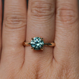 2.06ct Round Untreated Teal Montana Sapphire Hidden Halo Low Profile Evergreen Carved Four Prong Solitaire in 14k Yellow Gold